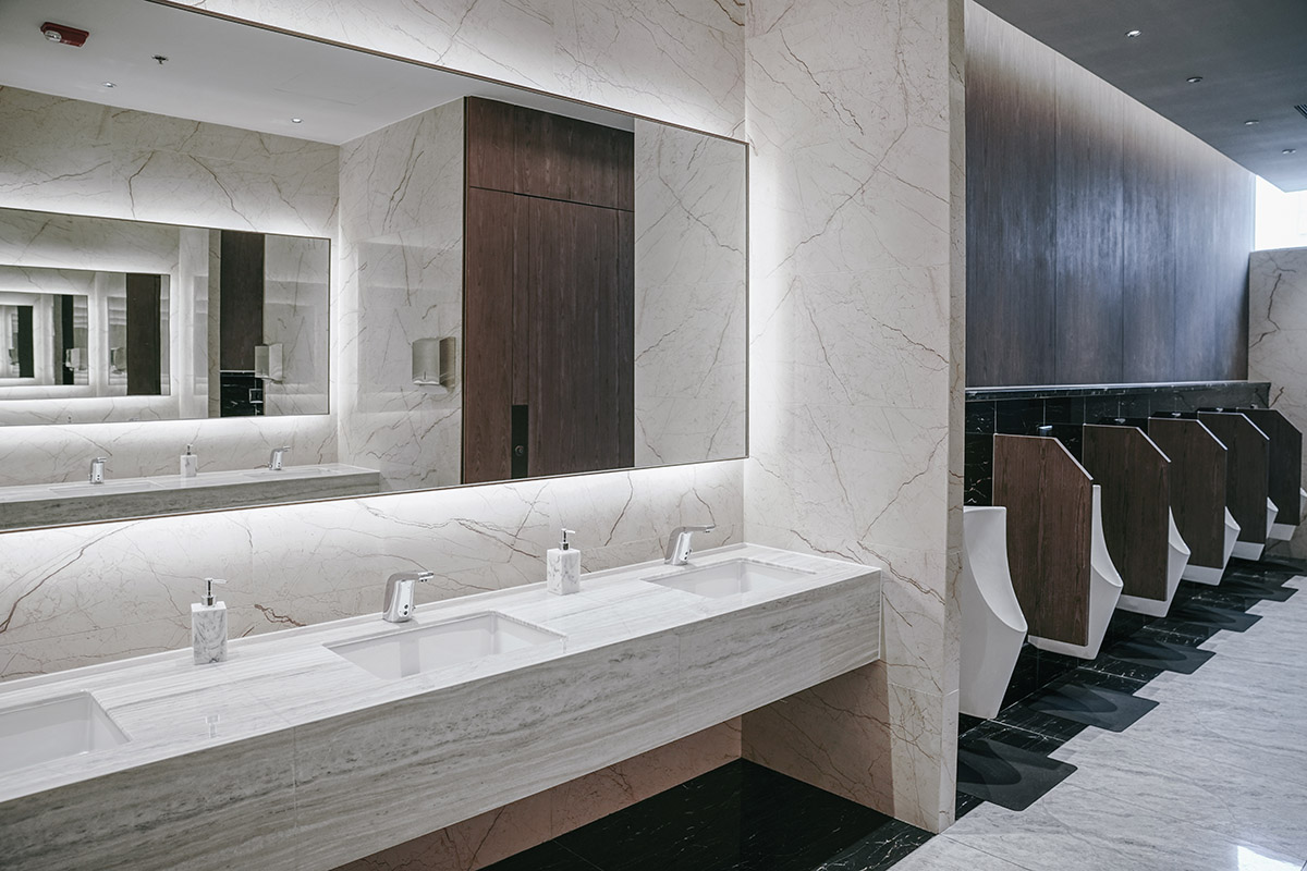 This is a photo of a stylish commercial men's bathroom installed and designed by Renovahouse in North Sydney